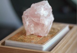 tarot deck with rose quartz crystal