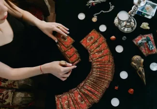 woman spreading tarot cards